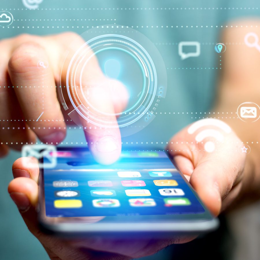 Businessman using a smartphone with a Contact icon surrounding by app and social icon – 3d render